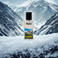 Blissful Kashmir eau de parfum bottle on snow with snowy mountain background and falling snowflakes