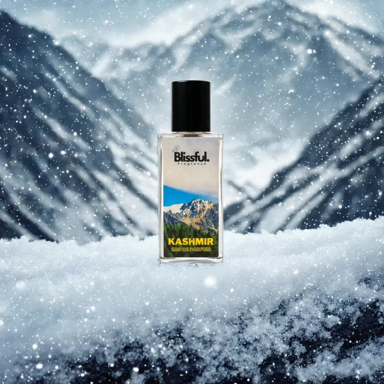 Blissful Kashmir eau de parfum bottle on snow with snowy mountain background and falling snowflakes