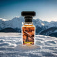 Blissful White Ball perfume bottle on snow with snow-covered mountains background