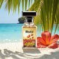 Blissful Floral Temptation perfume bottle on sandy beach with tropical palm leaves and red flower