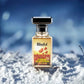 Blissful Floral Temptation perfume bottle with floral design on snowy surface and blue background