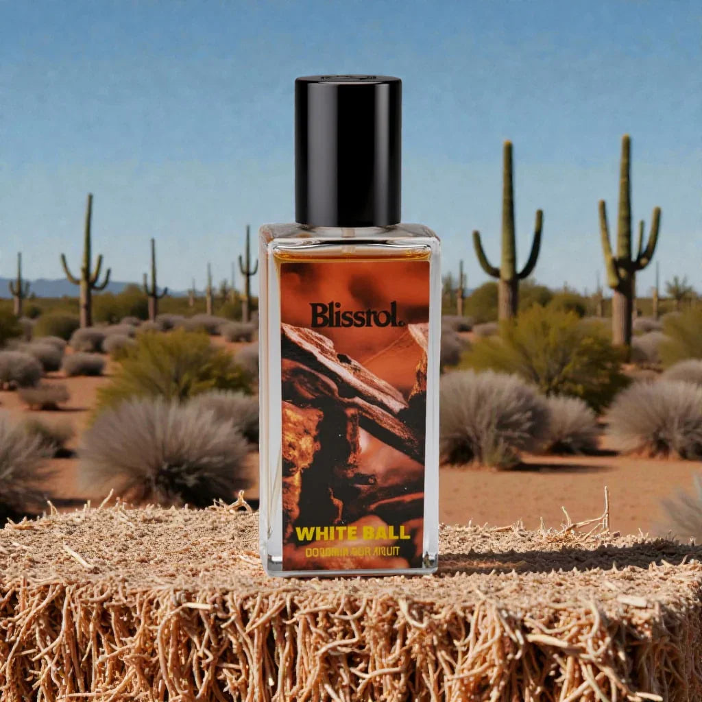 Blisrol White Ball cologne bottle on desert stump with cacti and clear sky background