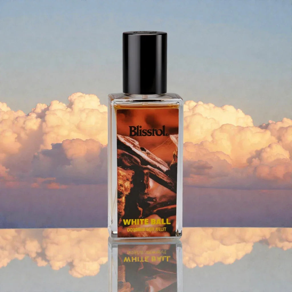 Blisstrol White Ball fragrance bottle with black cap against a backdrop of soft sunset clouds