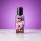Blissful Blue Lady eau de parfum bottle with pink flowers on purple background