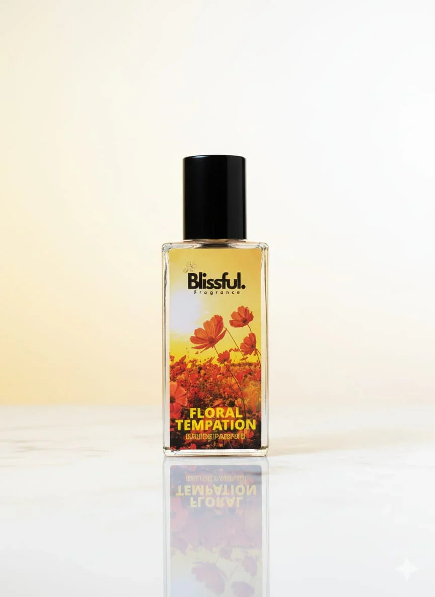 Blissful Floral Temptation eau de parfum bottle with orange flowers and black cap on white surface