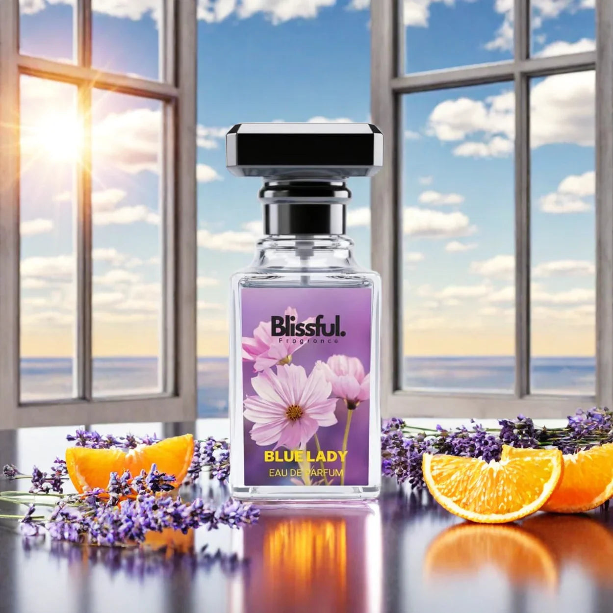 Blissful Blue Lady eau de parfum bottle with floral design, lavender sprigs, and orange slices by window